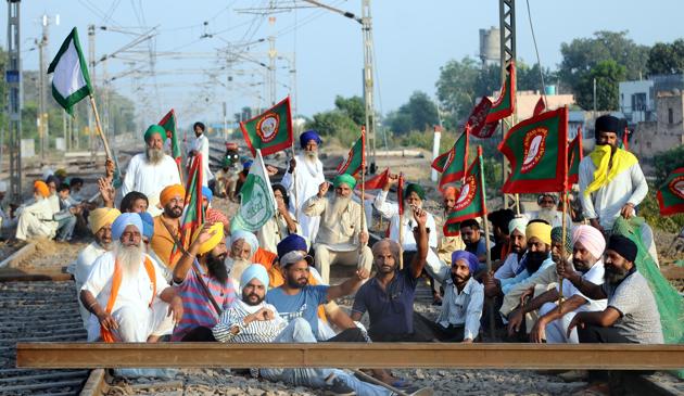 Farmers block railway tracks in protest against the farm reform laws passed by Parliament recently.(HT Photo)