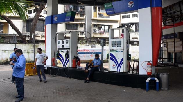 Commuters wait outside for a petrol pump to reopen after the grid failure in Mumbai on October 12. Power restoration efforts began on “war footing” and pocket-wise resumption in supply was started around 12 noon onwards, nearly two hours after the outage. Maharashtra Chief Minister Uddhav Thackeray took serious cognisance of a massive power outage in the Mumbai Metropolitan Region (MMR) and ordered an immediate probe. (Bhushan Koyande/ HT Photo)