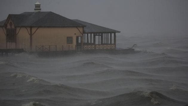 Storm surge moves past a boathouse as Hurricane Delta makes landfall in Lake Charles, Louisiana on October 9. Two days later, the storm had been downgraded to a post-tropical cyclone over the southern Appalachians, but still posed a heavy rainfall threat, the US National Hurricane Center said. (Luke Sharrett / Bloomberg)