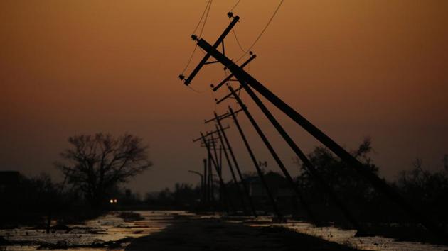 Utility poles are felled after Hurricane Delta made landfall in Creole, Louisiana on October 10. Many people who had started repairing their homes after Hurricane Laura saw efforts scattered by the wind brought in by Delhi. “Again, it’s going to set us back, but it’s not going to dictate our future,” Lake Charles resident Katie Prejean McGrady told AP. (Luke Sharrett / Bloomberg)