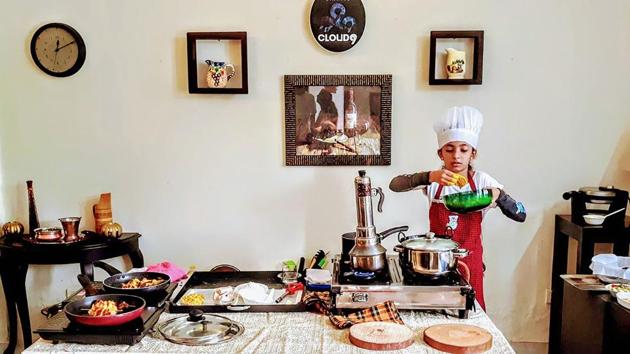 Saanvi M Prajit, daughter of Wing Commander of Indian Air Force Prajit Babu and Manjma hailing from Ernakulam, who has been recognised by the Asia Book of Records and the India Book of Records, prepares food, in Kochi. (PTI) Saanvi M Prajit, daughter of Wing Commander of Indian Air Force Prajit Babu and Manjma hailing from Ernakulam, who has been recognised by the Asia Book of Records and the India Book of Records, prepares food, in Kochi. (PTI)