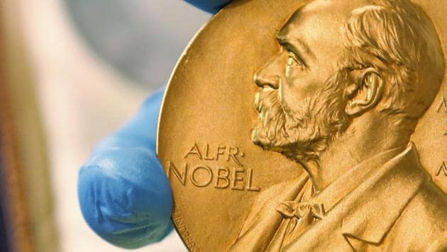 A file photo shows a gold Nobel Prize medal. Americans Paul R. Milgrom and Robert B. Wilson have won the Nobel Prize in economics for "improvements to auction theory and inventions of new auction formats.”(AP Photo)