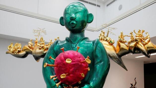 Displayed at the art exhibition held at the Vincom Centre for Contemporary Art in Hanoi, Vietnam, Pham Thai Binh’s “Land Genie” serves a stark contrast to the bleak ongoing pandemic. It showcases small figures occupied in various activities during the pandemic. Visitors gather around the sculpture to observe the work of art and get pictures clicked . (Reuters)