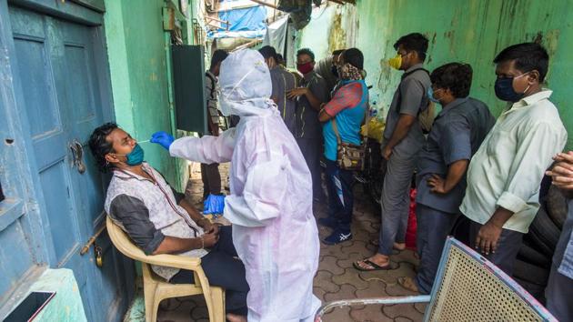 Healthcare workers during Covid-19 screening and swab test at Goregaon in Mumbai on Monday. (Satyabrata Tripathy/HT Photo) Healthcare workers during Covid-19 screening and swab test at Goregaon in Mumbai on Monday. (Satyabrata Tripathy/HT Photo)