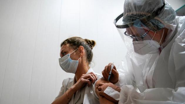A medic of the regional hospital receives Russia's "Sputnik-V" vaccine shot against the coronavirus disease in Tver, Russia. (REUTERS) A medic of the regional hospital receives Russia's "Sputnik-V" vaccine shot against the coronavirus disease in Tver, Russia. (REUTERS)