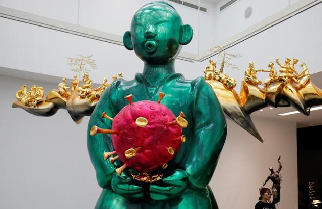 The small figurines on the ‘wings’ of the ‘Genie’ showcase people in various states of activities that people have indulged in during the lockdown period. (REUTERS)