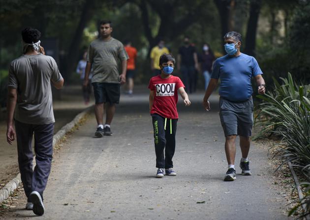 People, some wearing face masks jog at Lodhi Garden in New Delhi, India, on Sunday, October 11, 2020. (Photo by Biplov Bhuyan/ Hindustan Times) People, some wearing face masks jog at Lodhi Garden in New Delhi, India, on Sunday, October 11, 2020. (Photo by Biplov Bhuyan/ Hindustan Times)