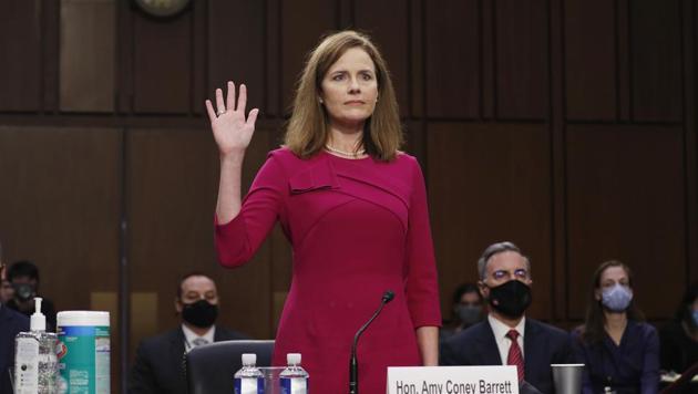 Amy Coney Barrett, US President Donald Trump's nominee for associate justice of the US Supreme Court, swears in to a Senate Judiciary Committee confirmation hearing in Washington, DC.(Bloomberg)