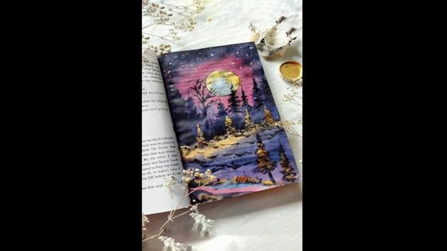 Artist paints on pages of a book leaves many mesmerised and some