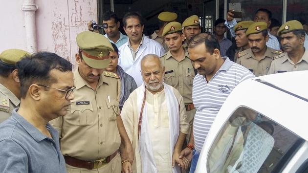 Former Union minister Swami Chinmayanand, accused of rape by a law student, is seen outside a government hospital after a medical examination following his arrest by a special team of Uttar Pradesh police, in Shahjahanpur.(PTI) Former Union minister Swami Chinmayanand, accused of rape by a law student, is seen outside a government hospital after a medical examination following his arrest by a special team of Uttar Pradesh police, in Shahjahanpur.(PTI)