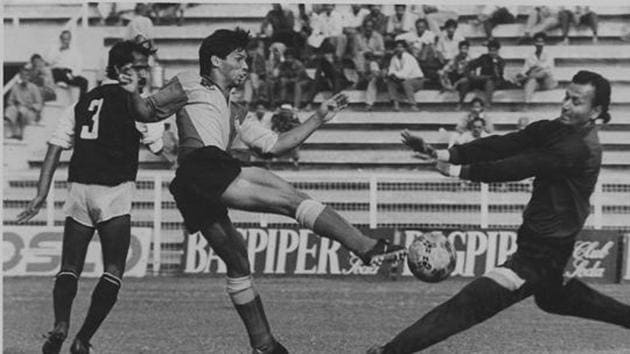 Mohammedan SC goalkeeper Nasir Ahmed rushes out to foil East Bengal striker Carlton Chapman in the Durand Cup quarter-final league match in New Delhi looking on is defender Asish Palchowdhury - HT Photo.