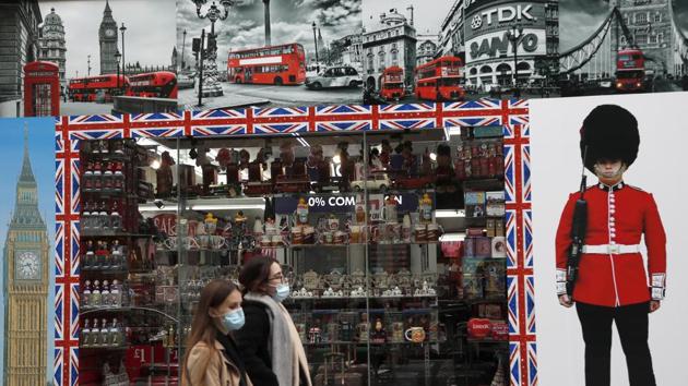 Shoppers walk past a shop window in Oxford Street, London on October 13. (AP) Shoppers walk past a shop window in Oxford Street, London on October 13. (AP)