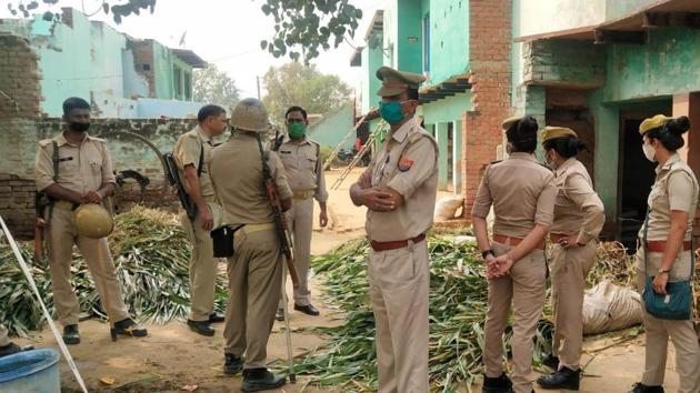 Police security outside the house of an accused in Hathras case.(HT Photo)