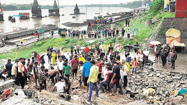 The 20-feet high wall came down when the temple town in Solapur district received heavy rains throughout the day on Wednesday. (HT PHOTO) The 20-feet high wall came down when the temple town in Solapur district received heavy rains throughout the day on Wednesday. (HT PHOTO)