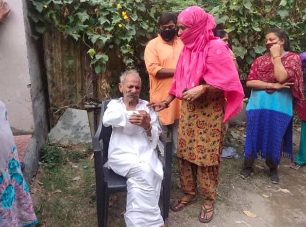 The victim’s inconsolable father-in-law following the discovery of her body in Dhakoli, Zirakpur, on Friday. (HT Photo) The victim’s inconsolable father-in-law following the discovery of her body in Dhakoli, Zirakpur, on Friday. (HT Photo)