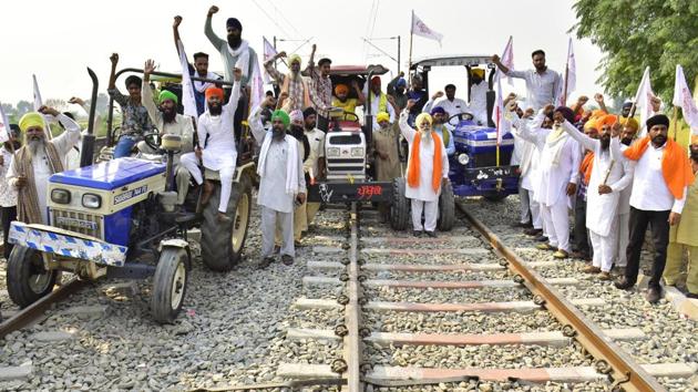 Farmers ride tractors on railway tracks during the ongoing 'Rail Roko' agitation against the Farm bills in Punjab.(HT Photo)