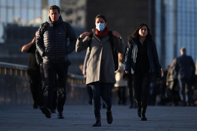 Commuters walk over London Bridge toward the City of London during morning rush hour(AFP) Commuters walk over London Bridge toward the City of London during morning rush hour(AFP)