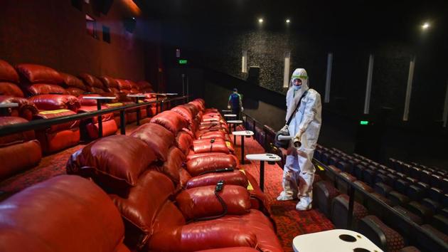 Under the new safety protocols, cinema hall owners are also required to ensure that auditoriums are sanitised after each screening and that there is no gathering at any space inside their premises. (PTI) Under the new safety protocols, cinema hall owners are also required to ensure that auditoriums are sanitised after each screening and that there is no gathering at any space inside their premises. (PTI)