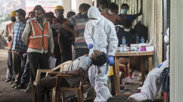 Healthcare workers during Covid-19 screening and swab test of Mumbai metro workers at Jogeshwari in Mumbai, India, on Wednesday, October 14, 2020. (Satyabrata Tripathy/HT Photo)