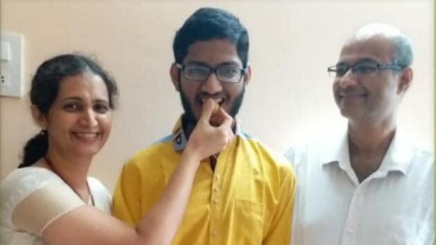 State topper Ashish Zantye (centre) with his parents. State topper Ashish Zantye (centre) with his parents.