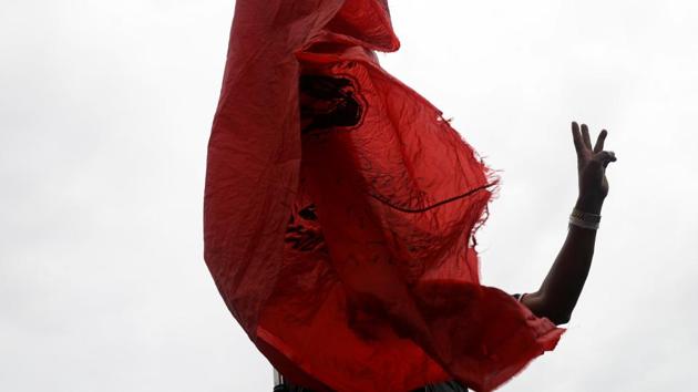 A person flashes the three-finger salute during a protest in Bangkok on October 14. The protest movement was launched in March by university students and its original core demands were new elections, changes in the constitution to make it more democratic and an end to intimidation of activists. The movement took an unprecedented turn in August when students criticized the monarchy and issued calls for its reform. (Soe Zeya Tun / Reuters)