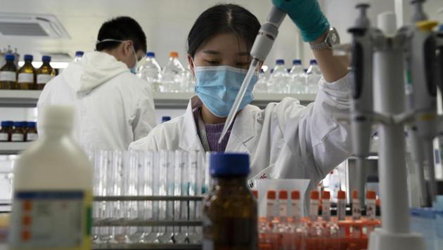 An employee of Sinovac works in a lab at a factory producing its SARS-CoV-2 vaccine for Covid-19 named CoronaVac in Beijing. (AP file)