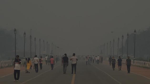 Morning walkers on the Rajpath amid hazy weather conditions, in New Delhi on October 15. (PTI) Morning walkers on the Rajpath amid hazy weather conditions, in New Delhi on October 15. (PTI)