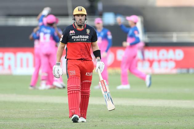 Aaron Finch walks back.