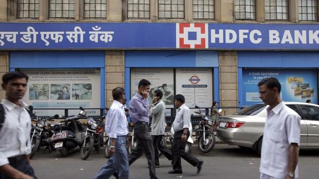 Pedestrians walk by an HDFC Bank Ltd. branch in Mumbai. (Bloomberg) Pedestrians walk by an HDFC Bank Ltd. branch in Mumbai. (Bloomberg)