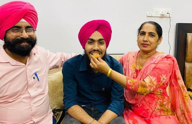 Gurkirat Singh celebrating his success with his family in Chandigarh on Friday. (HT Photo) Gurkirat Singh celebrating his success with his family in Chandigarh on Friday. (HT Photo)