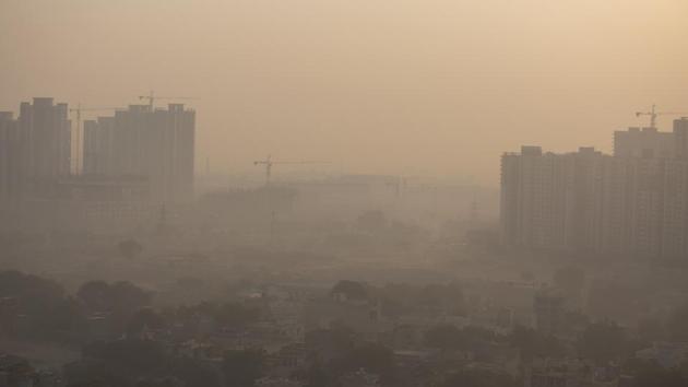 Morning haze envelops the skyline on the outskirts of New Delhi on October 16. The impact of the farm fires is felt in Delhi and its neighbouring areas which are grappling with deteriorating air quality that could aggravate the Covid-19 pandemic in the region, officials say. (Altaf Qadri / AP)