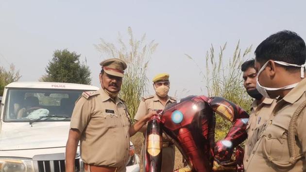 The image shows the police officials holding the Ironman-shaped ballon.(Twitter/@noidapolice)