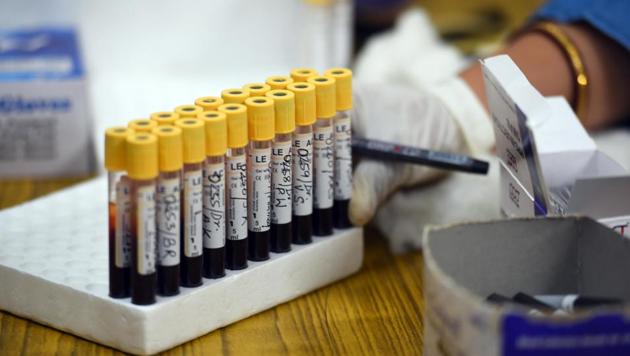 Medical staff work with samples taken during a serological survey for Covid-19 prevalence detection, at a government dispensary. (Raj K Raj/HT PHOTO) Medical staff work with samples taken during a serological survey for Covid-19 prevalence detection, at a government dispensary. (Raj K Raj/HT PHOTO)