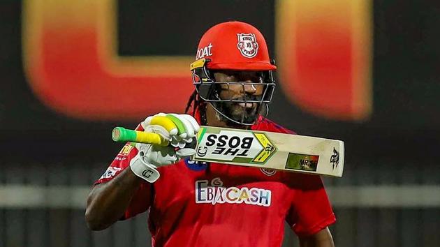Kings XI Punjab batsman Chris Gayle raises his bat after scoring a fifty during the Indian Premier League (IPL) cricket match against Royal Challengers Bangalore.(PTI) Kings XI Punjab batsman Chris Gayle raises his bat after scoring a fifty during the Indian Premier League (IPL) cricket match against Royal Challengers Bangalore.(PTI)