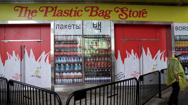A man stands outside the Plastic Bag Store, in Times Square, New York on October 16. The pop-up will be open for three weeks, when visitors can browse the art installation in small groups in hour-long intervals. (Carlo Allegri / REUTERS)
