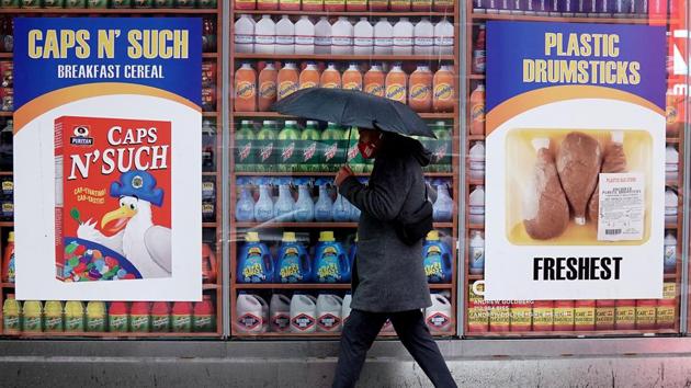 A man walks past the Plastic Bag Store, a pop-up to raise awareness of the environmental issues with plastics in Times Square, New York on October 16. The Plastic Bag Store is set to open to the public on October 22, on the heels of a fresh statewide ban in New York on the use of plastic bags that comes into effect on October 19 after delays due to litigation and Covid-19. (Carlo Allegri / REUTERS)