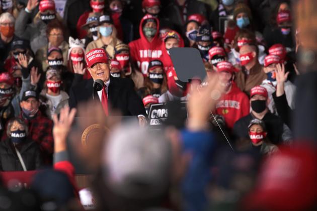 President Donald Trump speaks during a campaign rally at the Southern Wisconsin Regional Airport in Janesville, Wisconsin.(AFP)