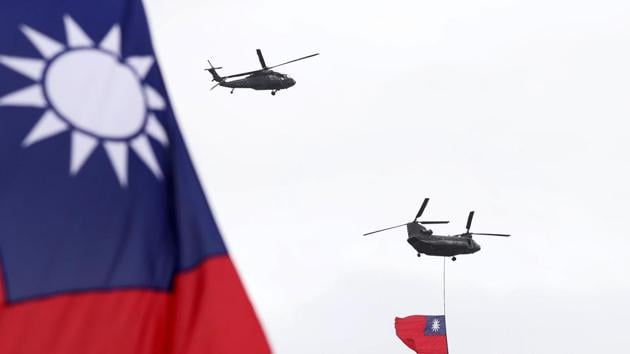 Helicopters fly over President Office with Taiwan National flag during the National Day celebrations in Taipei, Taiwan.(AP)