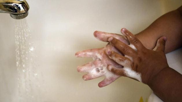 A child washes her hands at a day care center in Connecticut.(AP)