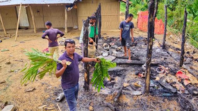 Assam officials inspecting the temporary huts which were torched on the Assam-Mizoram border on Saturday night. (HT photo) Assam officials inspecting the temporary huts which were torched on the Assam-Mizoram border on Saturday night. (HT photo)
