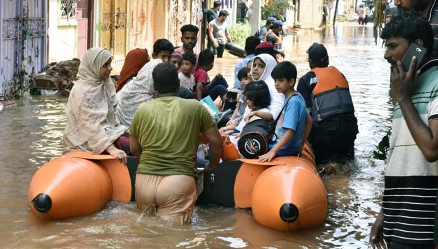 GHMC rescuing people including infants, children, and women from flood-affected Hafiz Baba Nagar following heavy rainfall, in Hyderabad on Sunday.(ANI photo) GHMC rescuing people including infants, children, and women from flood-affected Hafiz Baba Nagar following heavy rainfall, in Hyderabad on Sunday.(ANI photo)