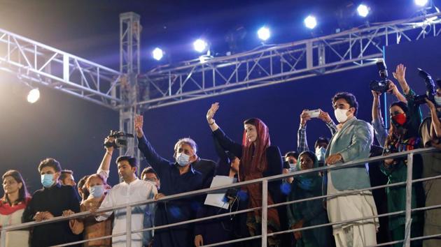 Maryam Nawaz, the daughter of Pakistan's former PM Nawaz Sharif, and Bilawal Bhutto Zardari, chairman of the Pakistan Peoples Party (PPP), are seen during an anti-government protest rally organised by the Pakistan Democratic Movement (PDM), an alliance of political opposition parties, in Karachi on October 18.(REUTERS)