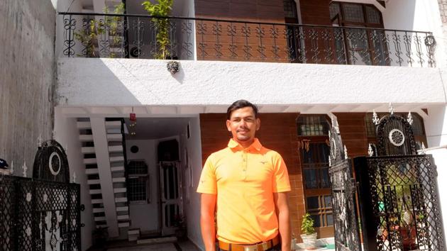 Chandigarh, India October 19, 2020: Caddy-turned professional golfer Akshay Sharma in front of his newly bought double-story house at Nayagaon on Monday, October, 19, 2020.(Photos by Keshav Singh/Hindustan Times.)