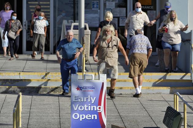 Voters leave the Polk County Government Center after casting their ballots Monday, Oct. 19, 2020, in Lakeland. (AP) Voters leave the Polk County Government Center after casting their ballots Monday, Oct. 19, 2020, in Lakeland. (AP)