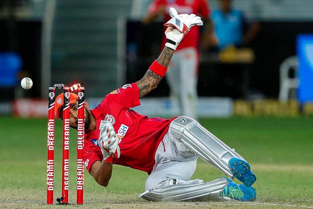 Dubai: Kings XI Punjab player KL Rahul attempts a run out during the Super Over of Indian Premier League (IPL) T20 cricket match against Mumbai Indians (MI) I, at Dubai International Cricket Stadium in Dubai, Sunday, Oct. 18, 2020. (PTI Photo/Sportzpics for BCCI)(PTI19-10-2020_000001B) (PTI)