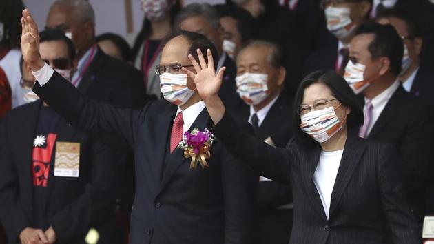 Taipei: Taiwan's President Tsai Ing-wen, right, and Yu Shyi-kun, speaker of the Legislative Yuan, cheer with audience during National Day celebrations in front of the Presidential Building in Taipei, Taiwan. AP/PTI Photo(AP10-10-2020_000050B) (AP) Taipei: Taiwan's President Tsai Ing-wen, right, and Yu Shyi-kun, speaker of the Legislative Yuan, cheer with audience during National Day celebrations in front of the Presidential Building in Taipei, Taiwan. AP/PTI Photo(AP10-10-2020_000050B) (AP)