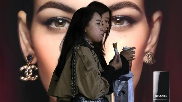 In Picture - People at a popular shopping mall in Beijing. Representational image.(AP) In Picture - People at a popular shopping mall in Beijing. Representational image.(AP)