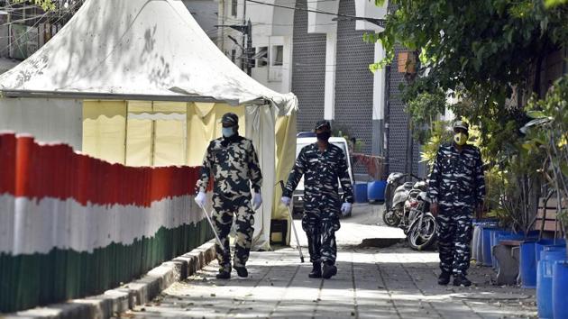 Paramilitary personnel seen at the cordoned off entry route to the Tablighi Jamaat's Alami Markaz Banglewali Masjid building on day twenty of the 21-day nationwide lockdown to curb the spread of coronavirus, in Nizamuddin, New Delhi.(Sanjeev Verma/HT PHOTO)