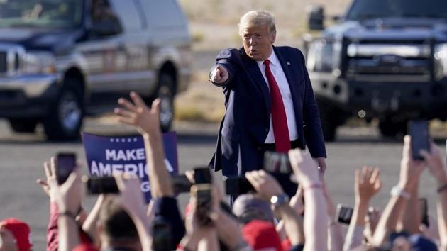 US president Donald Trump waves to a cheering crowd as he arrives for a campaign rally in Tucson, Arizona (AP/PTI Photo)