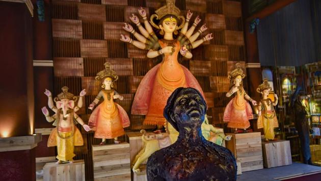 Idols of Hindu deity Durga and others are seen at a community puja pandal in Kolkata on October 19. Out of the 37,000 community pujas, more than 2500 are in and around Kolkata and around 1,700 pujas are being organised by women in West Bengal. (Ashok Bhaumik / PTI)